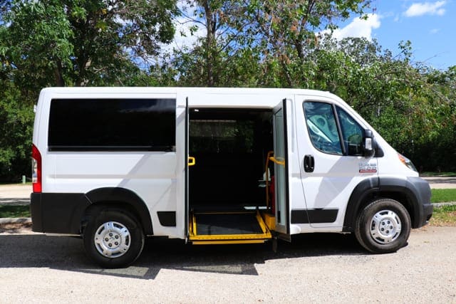 mobility van with powered ramp and doors parked in parking lot