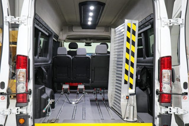 swinging bifold wheelchair ramp inside a ram promaster mobility van