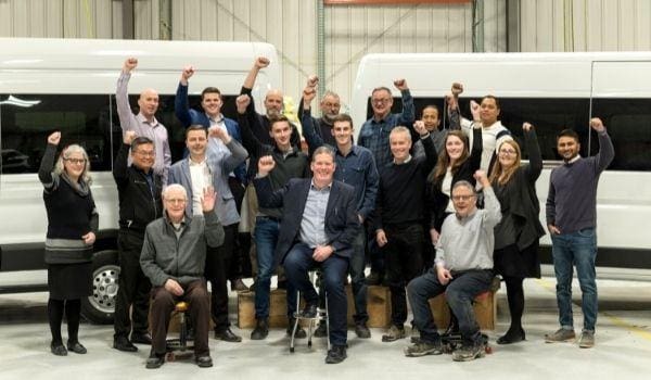 A group of people celebrating the end of year in a office