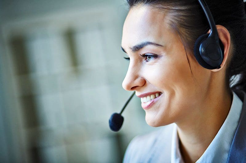 Smiling Executive Using Headset